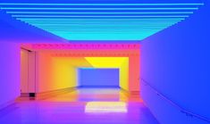 an empty room with neon colored lighting in the ceiling and white walls on either side