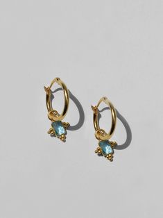 𝟵𝟮𝟱 𝗦𝘁𝗲𝗿𝗹𝗶𝗻𝗴 𝗦𝗶𝗹𝘃𝗲𝗿 Aquamarine Earrings. Created with 18kt gold plated 925 sterling silver & faceted aquamarine gemstones sourced from India. Beautifully bohemian, lightweight and comfortable for daily wear. ✦ Hoop Diameter: 20mm ✦ Drop Length: 1cm ✦ 18Kt 925 Sterling Silver, Aquamarine Faceted Gemstone. Sterling silver items are water safe. However, as a demi-fine metal, pieces constructed with this composition are slightly more delicate than that of our stainless steel range. Stainless Steel Range, Silver Items, Aquamarine Earrings, Birthstone Earrings, Earrings Bohemian, Earrings Dainty, Birthstone Earring, Bohemian Earrings, Aquamarine Gemstone