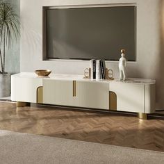 an entertainment center with a large television on it's sideboard in a living room