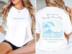 Get obsessed with this Nautical Tshirt! This Christian-inspired shirt features the scripture Isaiah 43 2 as a front and back design. Available in various colors. Perfect gift for our Christian folks that love the beach. *QUICK*FACTS* ✺The Comfort Colors 1717 tee is made with medium fabric (6.1 oz/yd² (206.8 g/m consisting of high quality, 100% ring-spun US cotton for long-lasting comfort.  ✺100% preshrunk cotton ✺ Wash and dry normally (on cool for best results) *SIZING* ✺ Models are wearing size small (some photos tee is knotted to the side, but it is sent untied, regular length) ✺ Sizing is unisex so runs like men's, though not overly large ✺ Most women find their typical size works best, since they are meant to fit a touch loose ✺ See size guide in listing to find your perfect fit. *SHI Jesus Is King Shirt, Scripture Isaiah, Isaiah 43 2, Jesus Clothes, Stay Salty, Jesus Is King, Isaiah 43, Be Still And Know, King Shirt