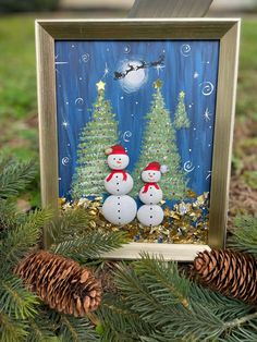 a christmas scene with two snowmen and pine cones