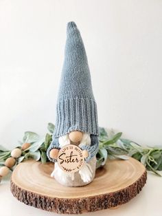 a knitted gnome's hat sitting on top of a tree stump