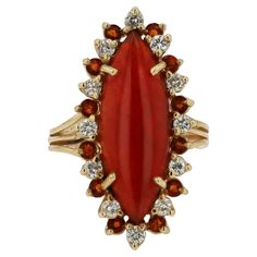 A fiery and affordable cocktail ring with a sizable carnelian showcased as the center gemstone. This red/orange gem, is worn for good luck, courage and strength. The surrounding halo alternates with elevated bright white diamonds and recessed vivid, deep orange Madeira citrines. The navette shape bears the classic elegance of an elongated, Mid Century Modern masterpiece. Acquired from a private Montecito, California estate, this vintage heirloom presents an excellent value and provides an excell Montecito California, Custom Ring Box, Orange Gem, Vintage Cocktail Ring, Deep Orange, For Good Luck, Pretty Rings, White Diamonds, Cocktail Ring