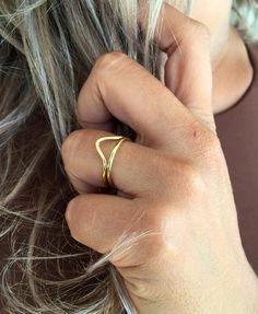 This is a triangle brass ring. V brass ring. A women's golden ring made of brass. It is an elegant and a minimalist design. It has a geometrical shape. It is very dainty, delicate and light wear.  A triangle represent strength, and can also represent concepts as past, present future or spirit mind and body.It is nickel free so it doesn't produce any allergies. It comes in a cute pouch so it is gift-ready.Urban jewelry, for those who not only want to wear special designs but also with meaning. Na Unique Open Brass Ring, Symbolic Brass Rings, Symbolic Polished Brass Ring, Minimalist Triangle-shaped Jewelry For Gifts, Minimalist Triangle Brass Jewelry, Onyx Ring Men, Urban Jewelry, Minimal Ring, Golden Ring