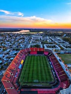 an aerial view of a soccer stadium at sunset