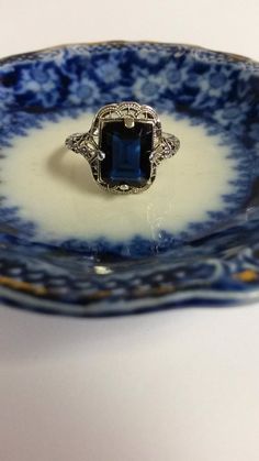 "Thanks for shopping our vintage estate store. We tend to sell well below wholesale and truly hope you enjoy all of our items. Many of the items are one of a kind, so please enjoy scrolling through the pictures and hopefully something will catch your eye. Black spots are from camera. Nice estate sterling silver 925 Blue 3ct Sapphire color stone filigree ring. This is a custom ring from our shop, meaning we set the gem into the setting. Gem is synthetic or created. Ring size: please select size S Vintage Sterling Silver Filigree Ring, Vintage Sapphire Jewelry For Formal Occasions, Vintage Sterling Silver Filigree Ring Collectible, Vintage Blue Filigree Ring For Anniversary, Vintage Filigree Ring Stamped 925 As Gift, Vintage Sapphire Ring Gift, Antique Blue Sapphire Collectible Ring, Antique Blue Sapphire Ring Collectible, Vintage Filigree Ring With Gemstone As A Gift