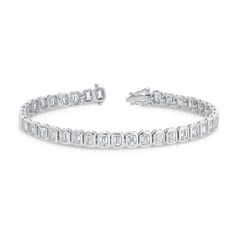 Design This tennis bracelet features vertically set emerald cut diamonds in a handmade bezel mounting. Details & Dimensions - 5.8 carats total (0.15 carats each diamond) - 6.5" length - G color, VS-SI clarity - Custom lengths and sizes available upon request. Email concierge@carbonandhyde.com. Formal Emerald Cut Diamond Bracelet With Single Cut Diamonds, Rectangular Diamond Tennis Bracelet With Accents, Classic Emerald Cut Baguette Diamond Tennis Bracelet, Emerald Cut Tennis Bracelet With Diamond Accents, Silver Emerald Cut Tennis Bracelet, Emerald Cut Diamond Accents Tennis Bracelet, Emerald Cut Diamond Bracelet With Accents For Anniversary, Classic Emerald Cut Diamond Bracelet With Accents, Emerald Cut Baguette Diamond Bracelets