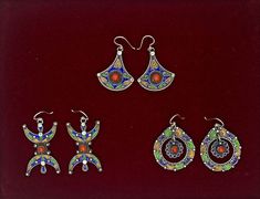 🎀 These earrings are absolutely gorgeous! Very lightweight and detailed. These earrings are made by hand in a traditional way, by a professional jeweler. Engraved, creatively designed, and decorated with precious multicolour enamel. 🎀 In our workshop, we not only create silver jewelry but also add to it a rich value associated with the authentic Moroccan culture. The artistic touch of these earrings lies in their simplicity, although they are engraved with various geometric shapes, different colors, and subtle details. 🎀 Creating that 'something a little different we strive for at Silver Scene, the stone sits at the center of two triangle shapes hand worked in silver. A gorgeous design, these earrings are light on the ear, easy to wear. 💚 Perfect as a gift for a loved one or as a littl Artisan Earrings With Artistic Design For Gift, Artisan Earrings With Artistic Design As A Gift, Artisan Teardrop Earrings With Artistic Design, Artisan Drop Earrings With Artistic Design, Artistic Teardrop Earrings As Gift, Artisan Plug Earrings As A Gift, Handmade Earrings As Festival Gifts, Artisan Earrings With Artistic Design, Artisan Round Earrings With Artistic Design