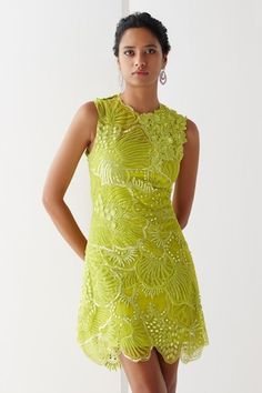 Lime green sleeveless layered short dress crafted in tulle with all over martian embroidery using tonal sequins, mirror, beads highlights and cut work hem. Comes with a satin lycra slip. - Aza Fashions Glamorous Spring Dresses For Reception, Glamorous Spring Reception Dresses, Green Sleeveless Mini Dress For Wedding, Sleeveless Embellished Dress For Wedding Guest, Green Embellished Mini Dress, Embellished Summer Dresses For Reception, Green Sleeveless Dress For Wedding Guest, Glamorous Green Sleeveless Mini Dress, Glamorous Green Mini Dress For Wedding