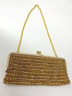 Very glamorous beaded evening bag - Gold-tone with rhinestones. In very, very good condition. Measures 8 inches across the bottom and 4 inches high Great for any formal event Glamorous Beaded Evening Bag For Formal Occasions, Glamorous Beaded Evening Bag For Formal Events, Glamorous Beaded Formal Shoulder Bag, Glamorous Bedazzled Rectangular Evening Bag, Bling Handheld Evening Bag, Glamorous Rhinestone-embellished Handheld Evening Bag, Gold Embellished Evening Shoulder Bag, Evening Handheld Bag With Bling, Glamorous Rhinestones Handheld Evening Bag