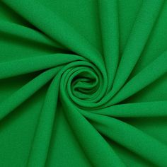 a close up shot of a green fabric