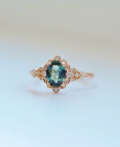 an oval blue and white diamond ring