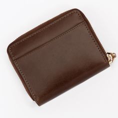 Zip Up Your Essentials in Style: The Mini Brown Leather Wallet for Women This mini zip-around wallet is crafted from smooth genuine brown leather and designed specifically for the modern woman on the go. It's the perfect blend of functionality and fashion, keeping your essentials organized and secure without weighing you down. Here's why you'll love it: Secure zip closure keeps your belongings safe and protected. Multiple card slots offer ample space for credit cards, IDs, and loyalty programs. Classic Compact Coin Purse With Card Slots, Classic Compact Coin Purse With Interior Card Slots, Classic Coin Purse With Card Slots For Daily Use, Classic Compact Wallet For Daily Use, Brown Rectangular Coin Purse For Business, Classic Coin Purse With Rfid Blocking For Daily Use, Rectangular Wallets With Leather Lining For Everyday Carry, Classic Compact Wallet For Everyday Use, Classic Coin Purse With Rfid Blocking