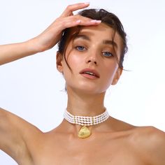 This elegant pearl choker features a gold-plated seashell-shaped pendant, making it a sophisticated addition to any jewelry collection, also perfect for summer wear. Shell jewelry Handcrafted from real sea pearls with 24k Gold plated brass seashell charm Nickel, lead and cadmium free Lobster clasp  Care To prevent oxidization and maintain long durability, keep your jewelry free of perfume, lotions, and sprays while using. It is advised to remove your gold-plated jewelry before showering. Make su Elegant Shell-shaped Pearl Drop Necklace, Elegant Shell-shaped Necklace With Pearl Charm, Shell-shaped Pearl Necklace With Pearl Pendant, Elegant Pearl Charm Shell Necklace, Elegant Shell Pearl Chain Necklace, Elegant Shell Pearl Necklace With Pearl Charm, Elegant Pearl Chain Necklace Made Of Shell, Elegant Pearl Necklace With Shell And Pearl Charm, Elegant Gold Shell Necklace With Pearl Charm