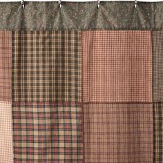 a patchwork shower curtain is shown in brown and tan