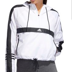 Elevate Your Outdoor Workout With The Adidas Women's Id Wind Half Zip Jacket. This Modern And Striking Jacket Features A Pullover, Half Zip Design With An Adjustable Hood. A Hemline With Cinch Tie Lets You Control Coverage, While Ripstop Material Is Lightweight Yet Keeps You Warm. Measurements - Pit To Pit 21.5”, Length Top To Bottom 21”.