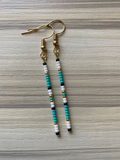 Trendy Gold Beaded Earrings With Dangling Beads, Trendy White Round Bead Earrings, Trendy White Round Beaded Earrings, Trendy White Dangling Bead Earrings, Trendy White Dangling Beads Earrings, Trendy White Earrings With Dangling Beads, Trendy Gold Beaded Earrings, Trendy Earrings With Tiny Beads As Gift, Trendy Earrings With Tiny Beads For Gifts