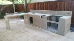 an outdoor kitchen is being built in the back yard