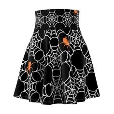 "The perfect bewitching skirt for spooky Halloween vibes with a standout spiderwebs and orange spiders pattern. Crafted with comfort in mind, the skirt is made from a high-quality and lightweight fabric blend that gracefully flows with every step you take. The soft and breathable material ensures you stay comfortable and confident throughout the day or night. The skater silhouette is a timeless classic, flattering all body types by cinching at the waist and flaring out gracefully over the hips. It accentuates your curves in the most flattering way possible, providing a versatile and easy-to-style piece that pairs wonderfully with both casual and dressy tops. With its elastic waistband, you'll enjoy a flexible fit that conforms to your shape without feeling restrictive, giving you the freed Halloween Cosplay Skirt, Fitted Halloween Skirt, Gothic Mini Skirt For Halloween Costume Party, Gothic Mini Skirt For Halloween Cosplay, Black Cosplay Skirt For Fall, Fitted Black Skirt For Halloween, Gothic Skirt For Halloween Costume Party, Gothic Black Skirt For Halloween, Gothic Skirt For Fall Costume Party