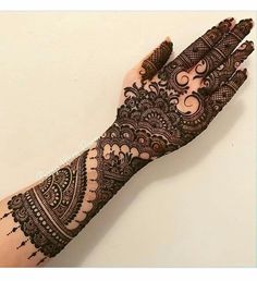 a henna tattoo is shown on someone's hand