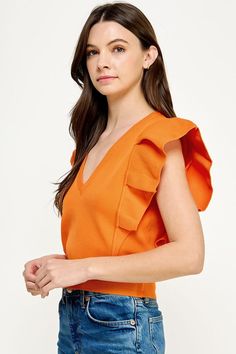 Orange deep V neck knit top with a dramatic pleated cap sleeve. 100% Nylon Elegant Solid Color V-neck Knit Top, Chic Summer Knit Top With Ruffle Sleeves, Trendy V-neck Knit Top For Spring, V-neck Knit Top For Summer Workwear, Spring Stretch Knit Top With Ruffle Sleeves, Chic V-neck Knit Top, Chic Knit Tops With Ruffles, Solid Color Flutter Sleeve Tops For Fall, Solid Flutter Sleeve Tops For Fall