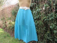 "This pretty pleated skirt  is perfect for spring, autumn and summer! DETAILS: rare skirt pleated skirt midi skirt fabric: silky polyester color: blue  elastic waist Very good condition. Measurements lying flat are: Waist: 16\" / 40,7cm  and more - skirt with elastic waist. Waist max: 18,5\" / 47cm  Length: 30,8\" / 78,1cm PLEASE NOTE: \"Laying flat\" means that \"waist \" NEED TO DOUBLED Size of approximately: EUR44 / 46 X UK16 / 18, but refer to measurements  Belt and blouse in photo are not included." Blue Full Skirt With Accordion Pleats, Spring Full Skirt With Accordion Pleats, Spring Full Accordion Pleated Skirt, Blue Midi Skirt With Accordion Pleats, Spring Blue Skirt With Accordion Pleats, Retro Pleated Spring Skirt, Vintage Blue Pleated Bottoms, Spring Full Skirt With Box Pleats, Spring Box Pleat Skirt