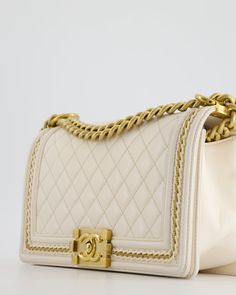 for more information on this item Brand - Chanel Model - Medium Boy Bag Collection - 17P Material - Lambskin leather Colour - White Hardware - Brushed Gold Accompanied by original dust bag, Chanel and Entrupy Measurements – 25cm x 16cm x 6.5cm Serial - 24 series Code - 24191134 Year - 2017 - 2018 Ref - 031057 Please note we are not affiliated with the brands we sell Please note that all of our items are unless stated otherwise and purchasing through us is contributing to an ethical and sustainable fashion future. All our items come with an . All sales are final. You are making great choices for the planet and for yourself, Love Sellier.Delivery 5-8 or 10-15 working days Please note that during high season and Sale period, delivery times may be affected We accept payment with a Credit card, Brushed Gold Hardware, White Hardware, Bag Chanel, Chanel Model, Gold Ounce, Bag Collection, Lambskin Leather, Chanel Bag, Gucci Bag