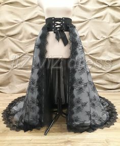 "DELIVERY TIME: 10-20 days Production time- 2 - 3 weeks. Please, in detail for your order, indicate the measurement of your WAIST! Lace Detachable Black Train for your black wedding! The train is made of some layers of tulle and one layer of lace Chantilly, which is attached to the hard satin belt. Size of the train what is on pictures of this listing: The back length of this train from а waistline is 1.7 meters (67'') The length in front of this train from а waistline is 1,2 meters (47\") . Ple Black Fitted Lace Corset Belt, Fitted Wedding Corset With Tulle Skirt, Black Party Dress With Detachable Train, Black Tulle Corset Dress For Evening, Black Lace Gothic Corset Belt, Black Lace Wedding Corset, Black Lace Corset For Wedding, Elegant Black Corset Belt For Costume Party, Black Lace Corset Belt With Corset Back