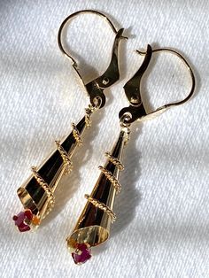 18k solid real gold and genuine Rby earrings,  1.35 grams weight Handmade item Colombian art Earrings Details Metal: 18k Yellow Gold 2 round genuine Rubies  Weight: 1.35 grams  Length: 3.5 cms - 1.4 inches  - A good investment since 18k solid gold items hardly go down in value and in fact would go up in value long term. * It's a very flattering minimalist earring perfect for any occasion. Packing Each order will be beautifully packaged for gift giving in a jewelry box. Colombian Art, Gold Items, Minimalist Earring, Art Earrings, Ruby Earrings, Fine Jewellery Earrings, Minimalist Earrings, Real Gold, Gift Giving