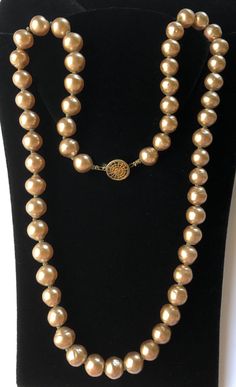 "Here is an enchanting vintage necklace by designer Miriam Haskell. It is beautifully crafted with a single gleaming strand of lustrous faux baroque pearls in a lovely light bronze hue. The necklace has a round gilt filigree box clasp for closure. The hardware is in gold tone metal. The necklace measures 24 1/2\" long and is marked with the designer's hallmark on the back of the box clasp. The vintage condition of this wonderful jewelry is very good other than wear mostly visible to the gilt see Miriam Haskell Necklace, Miriam Haskell Jewelry, Book Pieces, Miriam Haskell, Box Clasp, Rose Earrings, Crystal Pearls, Schmuck Design, Baroque Pearls