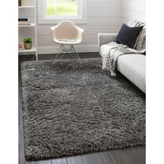 Find infinite bliss with the Infinity Shag Rug Collection! The far-out fibers of the 2 1/2" pile is shaggy and soft and perfect for sinking your toes into. A variety of colors and styles makes it easy to find the right rug for your decor. Smoke gray and linen beige bring a sense of soothing sophistication and create a neutral backdrop for colorful decor. Deep merlot red and playful pink lace call back to the glitz and glam of the golden age of Hollywood. The high pile gives you an unmatched leve Rugs Uk, Bed In Living Room, Large Dining Room, Square Rugs, Solid Rugs, Square Rug, Shag Area Rug, Unique Loom, Modern Traditional