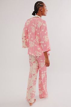 Have the sweetest dreams in this elevated PJ set from Wild Lovers, featuring a flattering long-sleeve top and relaxed bottoms in a two-tone printed design with tie details. **Fit:** Relaxed **Features:** Natural Modal fabrication, two-tone print; Top: Blousey style, V-neckline, tie-front closure, relaxed long sleeves, pleating at back; Bottoms: Low-rise, adjustable tie-side details, elastic waistband, side pockets **Why We | Emily Pajama Set by Wild Lovers at Free People in Pink, Size: S Unique Pajamas, Sweetest Dreams, Bridal Pajamas, Matching Pajamas, Lounge Set, Pj Sets, Kimono Fashion, Print Top, Printed Design