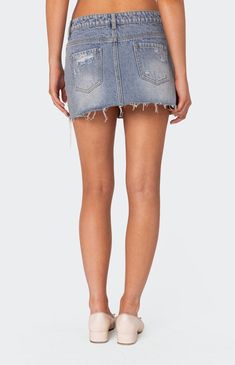 Online Only! Make a statement and command the room with the Ginnie Low Rise Distressed Denim Mini Skirt! Flaunting a low-rise waist and edgy distressed detailing, this skirt is crafted from denim fabric, offering both style and comfort. Complete with a raw edge hem, it's the perfect piece to elevate your casual chic look.


	Mini skirt
	Low rise waist
	Distressed detailing
	Raw edge hem
	Denim fabric
	100% Cotton
	Model wears size S
	Model height is 5'7
	Item care: Wash with similar color Ripped Mini Bottoms For Spring, Mid-rise Denim Mini Skirt With Frayed Hem, Ripped Mini Length Bottoms For Spring, Ripped High-rise Denim Skirt, Mid-rise Light Wash Mini Skirt With Frayed Hem, Casual Ripped Mini Bottoms, Ripped High Rise Mini Skirt For Spring, High Rise Ripped Mini Skirt For Spring, Spring High Rise Ripped Mini Skirt