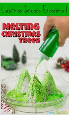 someone is pouring green icing on some christmas trees