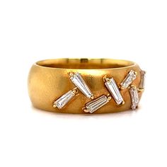 Warm up your ring collection with this one of a kind Wide Tapered Baguette Diamond Band in 18k Yellow Gold! The thick band features seven (7) .105 carat baguette cut diamonds. Set in a sparkling, dancing arrangement. A cocktail ring with something special. Finished in high polished 18K yellow gold. An everyday diamond stacking band to help you stand out from the crowd. Evening Rings With Baguette Diamonds, Evening Baguette Diamond Rings, Baguette Diamond Rings For Party, Baguette Diamond Ring With Diamond Accents, Party Rings With Baguette Diamonds, Yellow Gold Baguette Diamond Ring, Baguette Diamond Ring In Yellow Gold, Diamond Stacking Band, Baguette Diamond Band