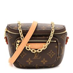 This is an authentic LOUIS VUITTON Monogram Mini Bumbag. This stylish belt bag is created out of a traditional Louis Vuitton monogram on coated canvas. The bag features an optional vachetta cowhide adjustable leather shoulder strap, and a removable short gold chain strap. The front zipper pocket and main zipper compartment open to a brown microfiber interior. Louis Vuitton Bum Bag Plus Size, Louis Vuitton World Tour Bumbag, Louis Vuitton Bum Bag White, Authentic Louis Vuitton, Chain Strap, Belt Bag, Front Zipper, Louis Vuitton Monogram, Gold Chain