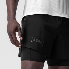 a man in black shorts with the word asrv on it's side