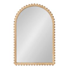 an arched mirror with scalloped edges and a wooden frame on the bottom half