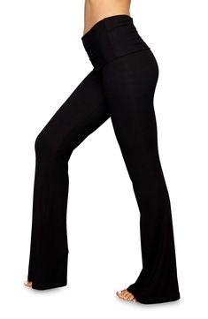 These soft, stretchy ribbed pants with a foldover waistband and flared legs are from Kim Kardashian West's sought-after SKIMS. 33 1/2" inseam; 21 1/2" leg opening; 9" front rise; 12 1/2" back rise (size Medium) 91% modal, 9% spandex Machine wash, dry flat Imported Fitted Wide Leg Loungewear Activewear, Fitted Wide Leg Activewear For Loungewear, Flare Yoga Bottoms, Flared Yoga Bottoms In Solid Color, Fitted Full Length Solid Yoga Pants, Flare Stretch Bottoms For Yoga, Stretch Flare Wide Leg Pants, Fitted High Waist Yoga Pants For Fall, Black Wide Leg 4-way Stretch Yoga Pants