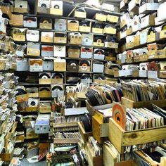 a room filled with lots of boxes and records