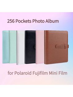 four different colors and sizes of the pockets photo album for polaroid fuji mini film