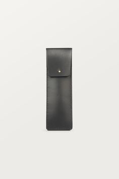 Classic and timeless BLACK PEN CASE with gold brass closure, made of high-quality sustainable (vegetable-tanned) genuine natural leather. This pen holder makes the perfect business gift for your colleagues, clients, or anyone else who appreciates quality and style. ✚ DIMENSIONS:  6 x 50,8 inch (6 x 19 cm) ✚ WHAT YOU CAN FIT IN IT: pens, pencils, crayons or markers. It will hold approx. 3-4 pens. ✚ PRODUCTION: the product is handmade entirely in Poland in our small leather craft workshop ✚ LEATHER: sustainable natural genuine vegetable- tanned leather, that has been tanned using extracts from the mimosa and quebracho trees. It comes from a Polish tannery and is stiff in texture. ✚ COLOR: black ✚ INTERIOR FINISH: suede, unlined ✚ CLOSURE: brass button studs (gold) ✚ PACKAGING: 100% eco-frien Black Rectangular Pencil Case For Everyday Use, Black Rectangular Everyday Pencil Case, Rectangular Black Everyday Pencil Case, Modern Black Pencil Case For Everyday Use, Modern Black Pencil Case For Everyday, Classic Rectangular Pencil Case For Gift, Black Leather Pencil Case With Pen Holders, Black Pencil Case With Pen Slots As Gift, Black Pencil Case With Pen Holders As Gift