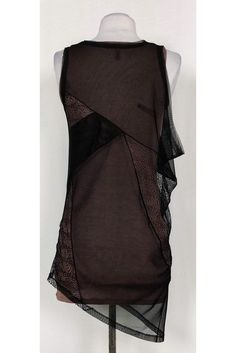 Great for day or night, this chic tank top is a versatile choice. Designed with a taupe tank top lining and an edgy mesh and lace overlay. An asymmetrical hemline tops off the garment. Size XXS Shell: 80% polyester, 20% spandex Contrast 1: 100% nylon Contrast 2: 86% lyocell, 9% wool, 5% spandex Slips on Rounded neckline Mesh & lace overlay Taupe tank lining Bust 23" Shoulder to hem 26" - tank top lining, 33"- overlay Sheer Stretch Mesh Camisole Top, Sheer Mesh Camisole Top For Party, Sheer Sleeveless Mesh Top For Evening, Spring Mesh Tank Top For Night Out, Sheer Sleeveless Mesh Top For Night Out, Sleeveless Sheer Mesh Top For Night Out, Sheer Fitted Tank Top For Evening, Chic Sheer Tank Top For Party, Edgy Black Camisole Tank Top