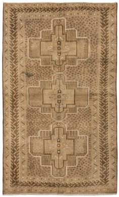 an antique rug with geometric design on the front and back ends, in beige tones