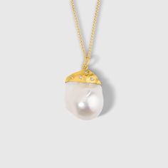 "Large, 67.05ct Baroque Pearl Pendant Necklace with Diamonds, 24kt Solid Gold by Prehistoric Works of Istanbul, Turkey. Baroque Pearl - 67.05cts, Diamonds - 0.07cts. Measures: X-large, Width - 21.6mm (.8\") x Length - 32.6mm (1.3\") x Depth - 18.3mm (.7\"), Total Weight:14.8 grams. Chain options available. Throughout the centuries, pearls have been associated with wealth, femininity, purity, wisdom, patience and peace. Due to their appearance, they have often been compared to the moon, and are s Luxury Pear-shaped Necklaces With Diamond Accents, Luxury Pear-shaped Gemstone Necklace, Exquisite Yellow Gold Pearl Necklace, Yellow Gold High Luster Pearl Necklace For Wedding, Exquisite Yellow Gold Pendant Pearl Necklace, Luxury Yellow Gold Necklace With High Luster, Exquisite Gold Necklace With Single Cut Diamonds, Gold Baroque Pearl Necklace For Formal Occasions, Luxury Pear-shaped Single Cut Diamond Necklaces