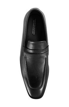 A memory foam insole brings lasting comfort to an elegant loafer shaped by a tapered toe. Memory foam cushioned footbed Synthetic upper, lining and sole Imported Classic Black Medium Width Loafers, Classic Black Semi-formal Loafers, Timeless Black Semi-formal Loafers, Medium Width Synthetic Slip-on Loafers, Black Loafers With Leather Footbed, Medium Width, Penny Loafers Men, Penny Loafers, Memory Foam, Tommy Hilfiger