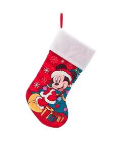 a mickey mouse christmas stocking hanging on a wall