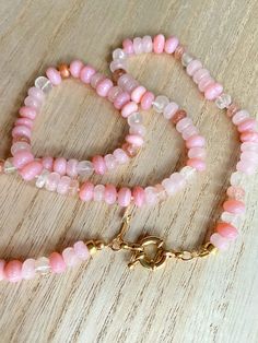 This beautiful pink gemstone necklace makes a perfect gift! Each bead is hand knotted onto silk thread, which gives the necklace a lovely drape.Necklace is 21 inches long, hand knotted with white silk string, gold filled beads, and has gold filled clasp. This is a stunning necklace that completes any outfit. This necklace is a perfect gift!   GEMSTONES  Pink Opal (dyed) Sunstone Rose Quartz Aquamarine Gold Filled Findings BENEFITS OF A HAND KNOTTED NECKLACE 1. A knotted necklace is safe and secu Luxury Hand-knotted Beaded Necklaces As Gift, Beaded Rose Quartz Crystal Necklace, Pink Hand-strung Round Bead Necklaces, Pink Hand-strung Round Beads Necklace, Pink Healing Faceted Bead Necklaces, Pink Spiritual Crystal Necklaces With Faceted Beads, Adjustable Rose Quartz Round Bead Necklace, Healing Pink Faceted Bead Necklaces, Rondelle Crystal Necklace With Gemstone Beads