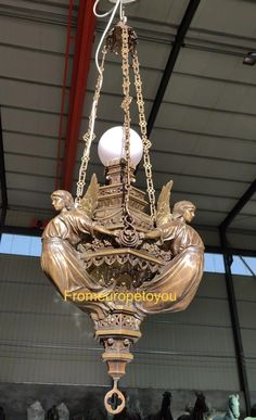 an ornate chandelier hanging from the ceiling