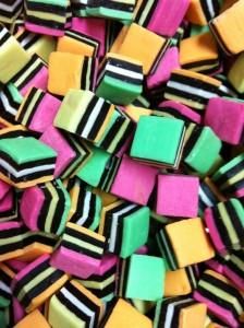 multicolored pieces of candy sitting on top of each other